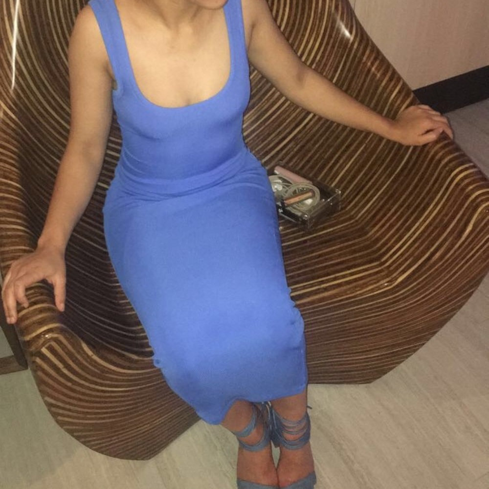 Bright blue body-con style dress.